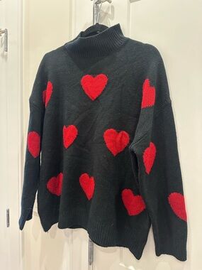 Black Turtleneck Sweater with Red Heart Pattern